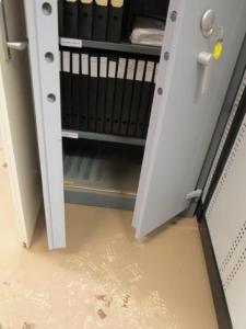 Cabinet affected by water damage in collection store.
