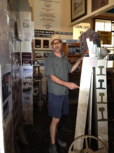 Ewen McPhee showing the height of the flood