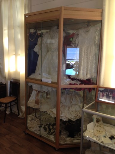 wedding dress display - note the photographers skill of also getting in the reflection of the sea