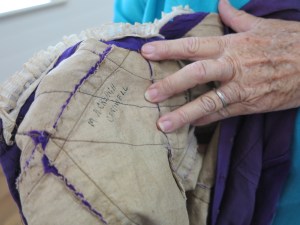 Stephanie showing the signed dress